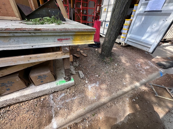 Tree trunk surrounded by construction equipment